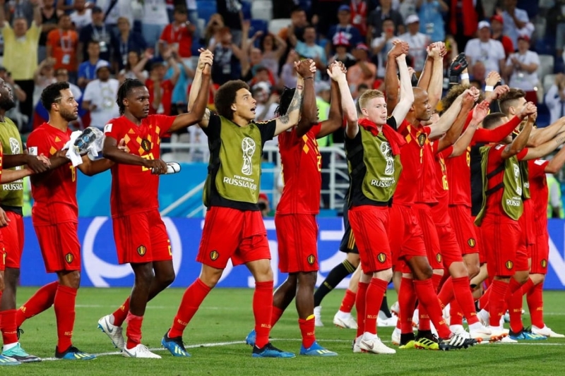 Belgium players celebrate finishing top of group G after the win over England. Photo: Reuters