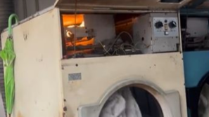 香港街头惊见“洗衣机”起火吓坏内地女！网民嘲见识少