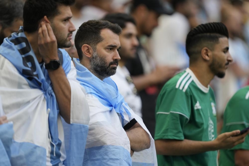 Fans watch the World Cup group C soccer match between Argentina and Saudi Arabia at the Lusail Stadium in Lusail, Qatar, Tuesday, Nov. 22, 2022. (AP Photo/Jorge Saenz)