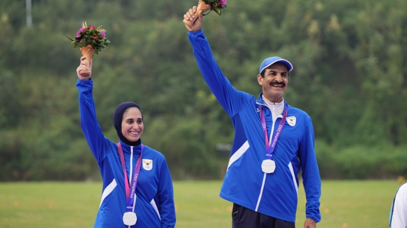 拉希迪和女搭档28日在飞碟双向混合团体赛夺银铜牌。 拉希迪和女搭档28日在飞碟双向混合团体赛夺银铜牌。