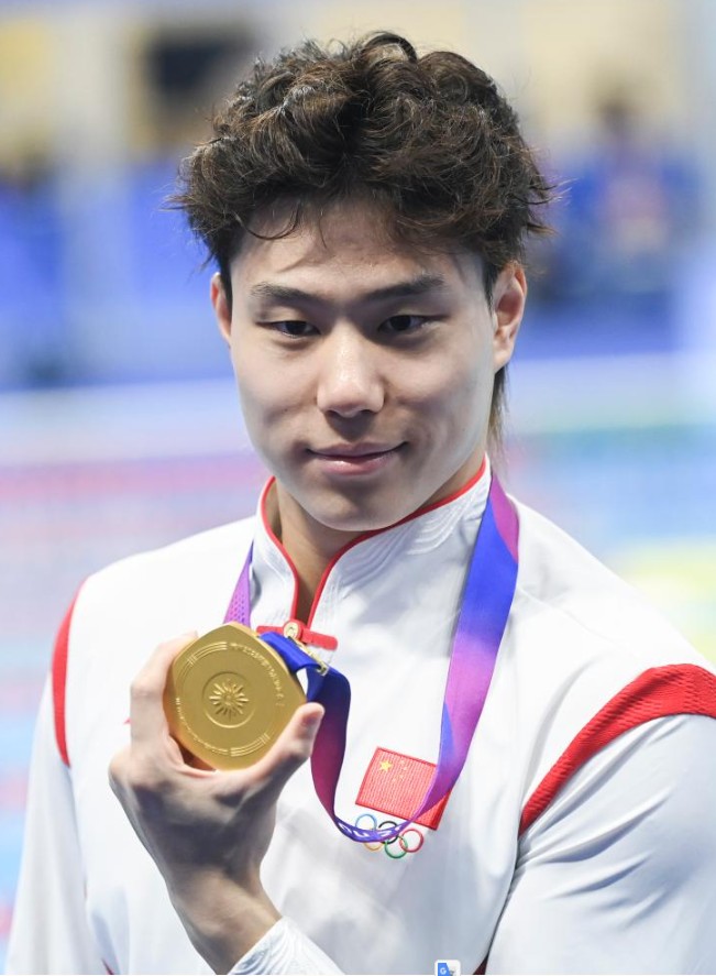 覃海洋在男子50米蛙泳决赛中夺得金牌。新华社 覃海洋在男子50米蛙泳决赛中夺得金牌。新华社