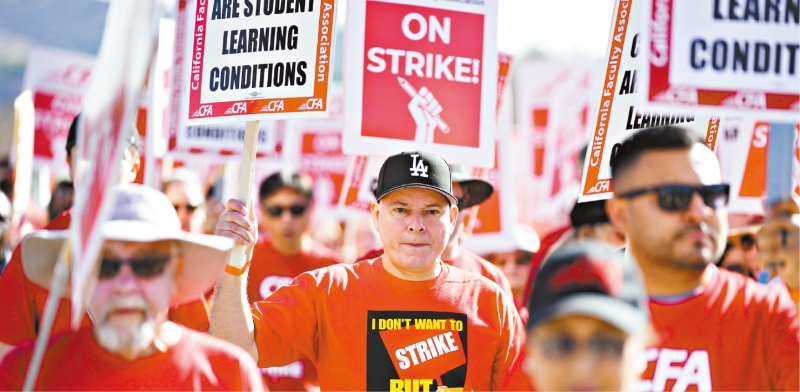 波莫纳加州理工大学教职员4日罢工一天,另外三所州大将于本星期跟进。美联社 波莫纳加州理工大学教职员4日罢工一天,另外三所州大将于本星期跟进。美联社