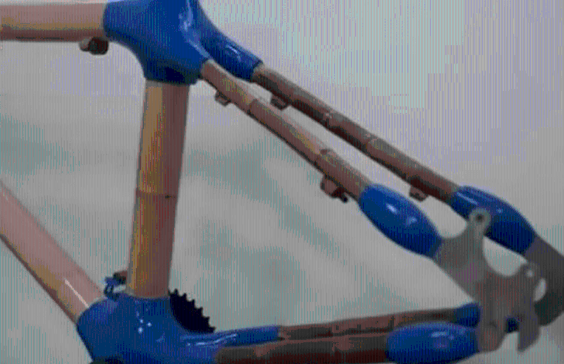 谭江永称车架前三角采用空心楠竹，实心竹则用于后三角结构。