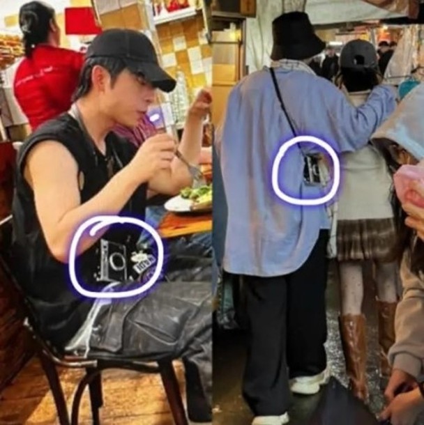 疑似是吕爵安的男士只见到背影,头戴渔夫帽穿长袖衫阔裤,揹住一个相机造型的斜肩包,跟当日与林明祯撑枱脚的一模一样。 疑似是吕爵安的男士只见到背影,头戴渔夫帽穿长袖衫阔裤,揹住一个相机造型的斜肩包,跟当日与林明祯撑枱脚的一模一样。