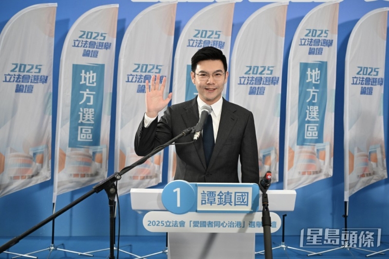 新社联谭镇国。