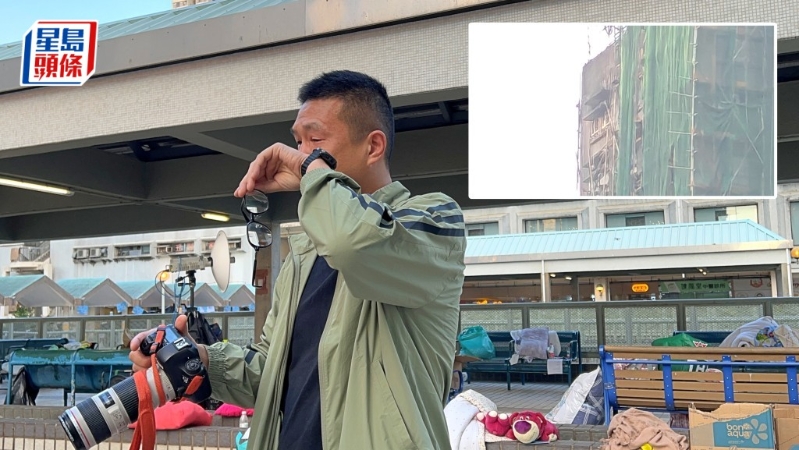 陆先生借用记者长镜头遥望居所，见家园尽毁不禁伤心落泪。